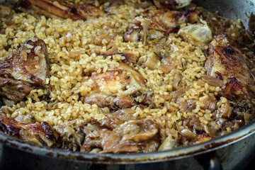 Stewed chicken with onion confit and bulgur.