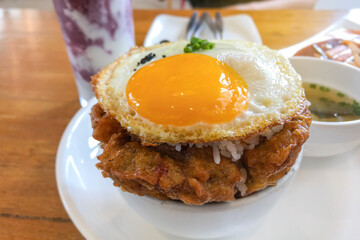 Kimchi fried rice with fried egg and pork. Korean food style.
