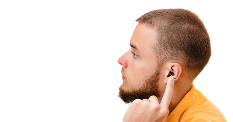 Obraz premium Man patient showing Intra-ear hearing aid inside his ear, close-up. Hearing solutions for deafness treatment