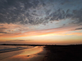 Fototapeta na wymiar Orange sunset on the beach