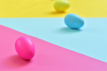 Easter layout made with Easter eggs and colorful background. Spring holidays concept. Creative copy space. Flat lay.