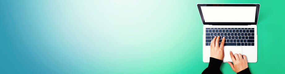 Person using a laptop computer from above