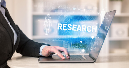 Doctor working a health check with RESEARCH inscription, recording medical test results