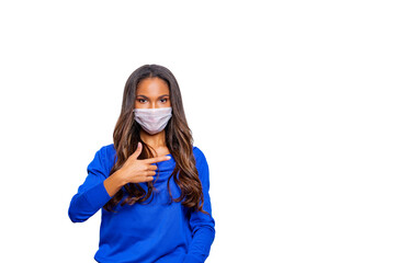 Masked woman - protection against influenza virus. African - American woman wearing medical mask for protect. model poses in studio making hand gesture. Stop the virus and epidemic diseases. isolated 