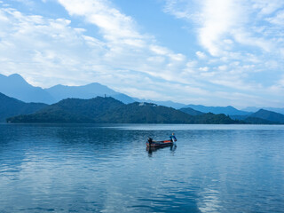 Fototapeta na wymiar Sun Moon Lake with boat in the morning, Taiwan.