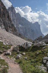 Fototapeta na wymiar On Alta Via (High Route) Dolomiti #1 trail #560 from Coldai refuge to Tissi refuge via Col (pass) Negro di Coldai at the foot of Civetta mountain range, Dolomites, Alleghe village, Belluno, Italy