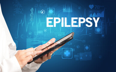 young doctor writing down notes with EPILEPSY inscription, healthcare concept