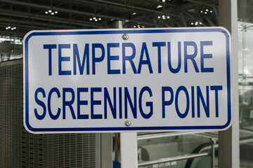 Fototapeta premium Temperature screening point sign in public transportation (airport, bus station, subway, train station), to reduce risk of further transmission, covid screening point concept