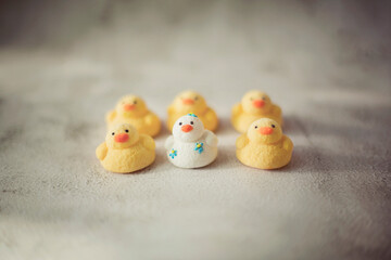 
marshmallows in the form of ducks of different colors
