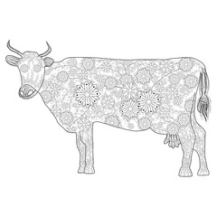 Hand drawn doodle outline cow head decorated with ornaments. zentangle illustration.Floral ornament.
