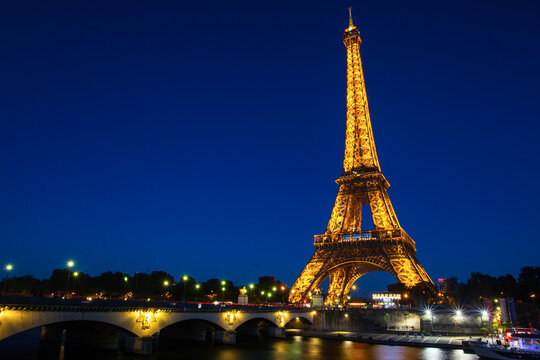 PARIS - OCTOBER 4: Eiffel Tower in festive illumination to Birthday (it is open on March 31 1889), view from the Seine quay, October 4, 2016 in Paris, France.