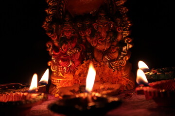 hindu idols and oil lamp for diwali background