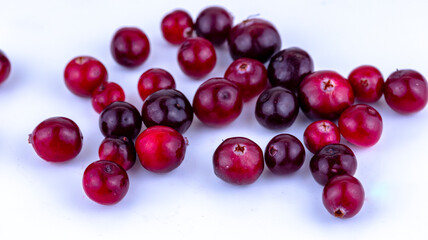 cranberry berries on a white background, macro photography , soft focus