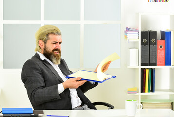 CEO has to be moral leader of company. Man bearded boss sit office. Manager solving business...