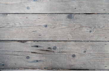 Textured floor made of old gray boards.