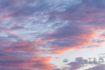 Sunset illuminating the clouds in the sky.