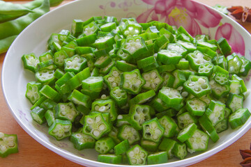 Sliced green seed pods of Okra, Abelmoschus esculentus, ladies fingers close up