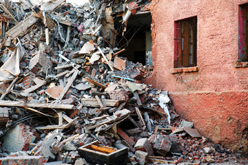 Pile of demolition rubble. Gray rubble at a building site.