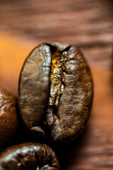 macro shot coffee bean closeup over wooden background