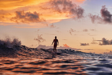 Fototapeta na wymiar silhouette of a person surfing