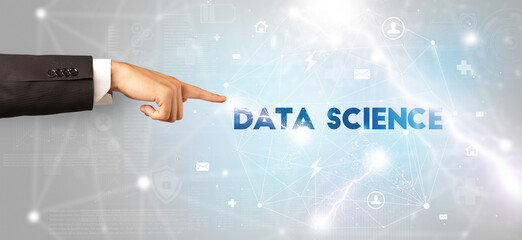 Hand pointing at DATA SCIENCE inscription, modern technology concept