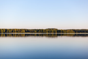 Calm lake surrounded by forest. Poland