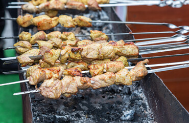 Shashlik during of cooking on the mangal over hot charcoals
