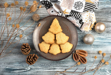 Christmas tree of cookies on a plate on a Christmas background. The view from the top. The concept of New year and Christmas.
