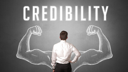 Rear view of a businessman with CREDIBILITY inscription, powerfull business concept