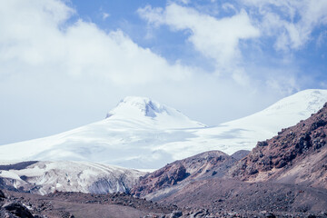 Fototapeta na wymiar big Elbrus mountain in summe on cloudy day