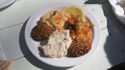 Royal plate on royal table of Moroccan food, Hummus, babaganoush, Falafel, Marrakesh salad and bread
