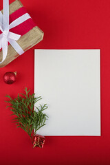 New year wish list with festive elements on red table.