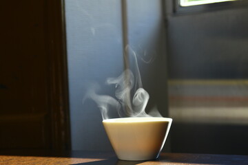 Miso soup in a bowl, steaming in sunlight
