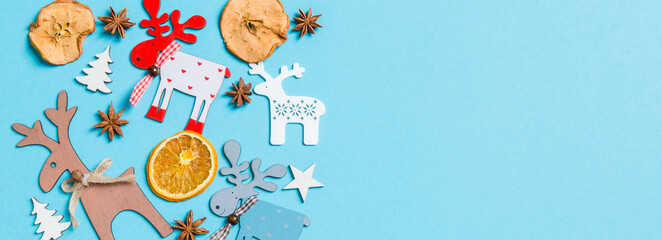 Top view Banner of holiday decorations and toys on blue background. Christmas ornament concept with empty space for your design