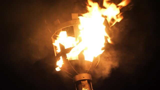 A burning torch in the night