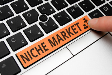 Text sign showing Niche Market. Business photo showcasing Subset of the market on which specific...