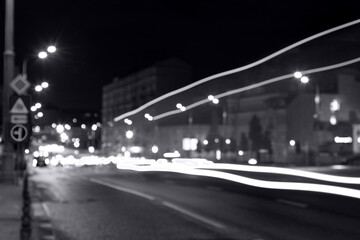 Fototapeta na wymiar long exposure, light traces from traffic on the background of a night city