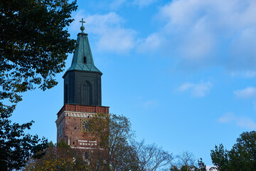 Fototapeta na wymiar Turku Cathedral against a blue cloudy sky. Copy space.