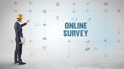 Engineer working on a new social media platform with ONLINE SURVEY inscription concept