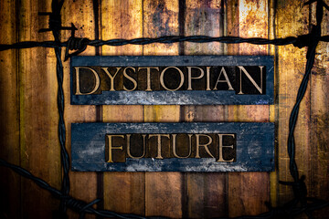 Dystopian Future text formed with real authentic typeset letters surrounded by barb wire on vintage textured silver grunge copper and gold background