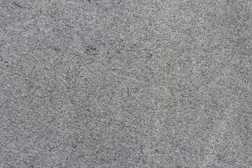 The texture of a natural stone slab from polished granite.