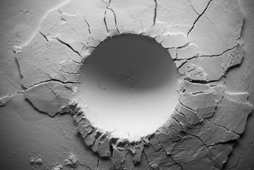 Round crater in black and white. A crater with cracks. - obrazy, fototapety, plakaty