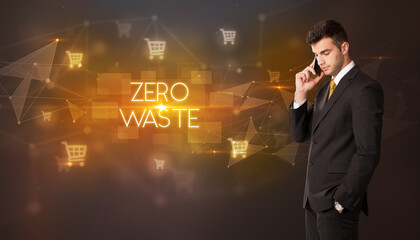 Businessman with shopping cart icons and ZERO WASTE inscription, online shopping concept