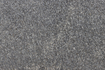The texture of a natural stone slab from polished granite.