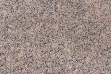 The texture of a natural stone slab from polished granite.