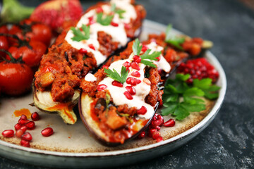 Baked eggplant with tomatoes, garlic and paprika and pomegranate.