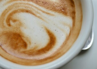 Cup of coffee with creamy milk foam