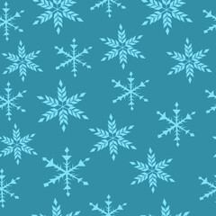 Fototapeta premium Seamless pattern of snowflakes on a blue background