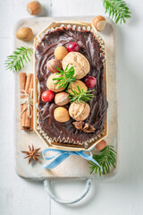 Top view of gingerbread cake with nuts for Christmas