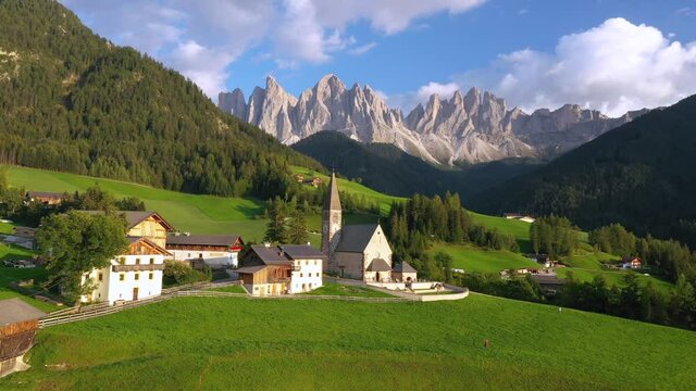 Aerial of the beautiful Santa Maddalena Church, Val Di Funes, Dolomites, Northern Italy